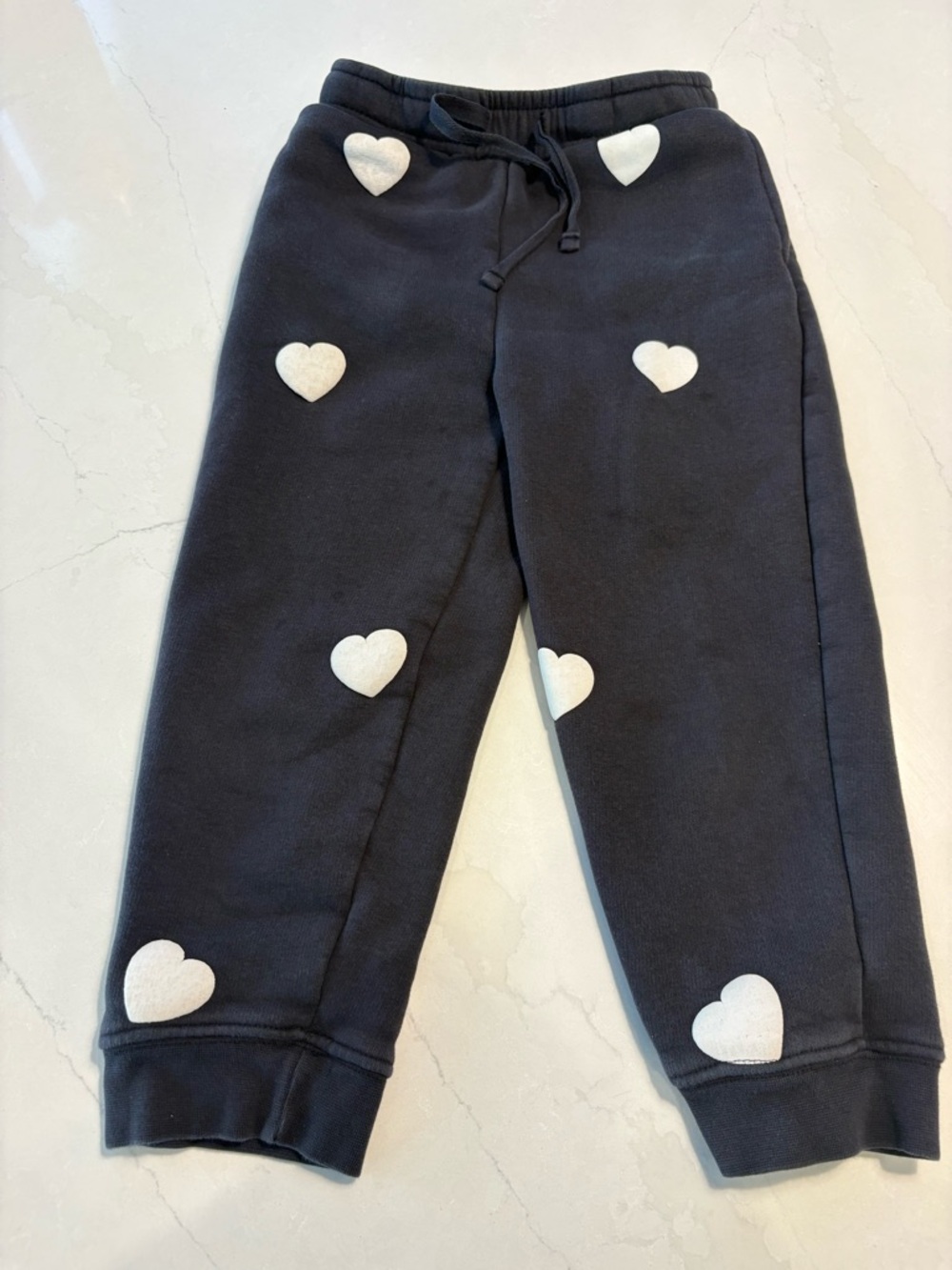 Brunette The Label Black Joggers with White Heart Appliqués